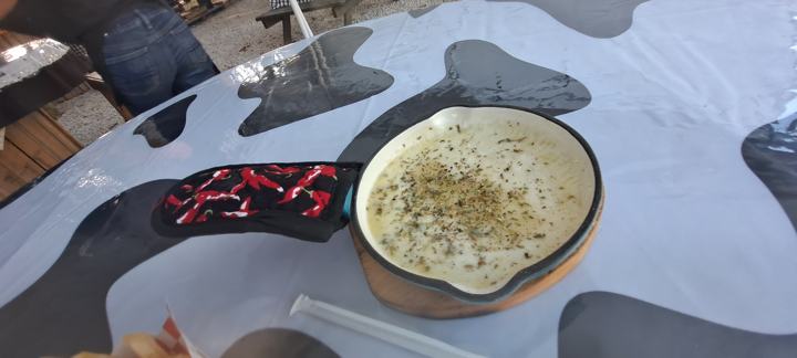 Melted cheese skillet on a cowhide-print table